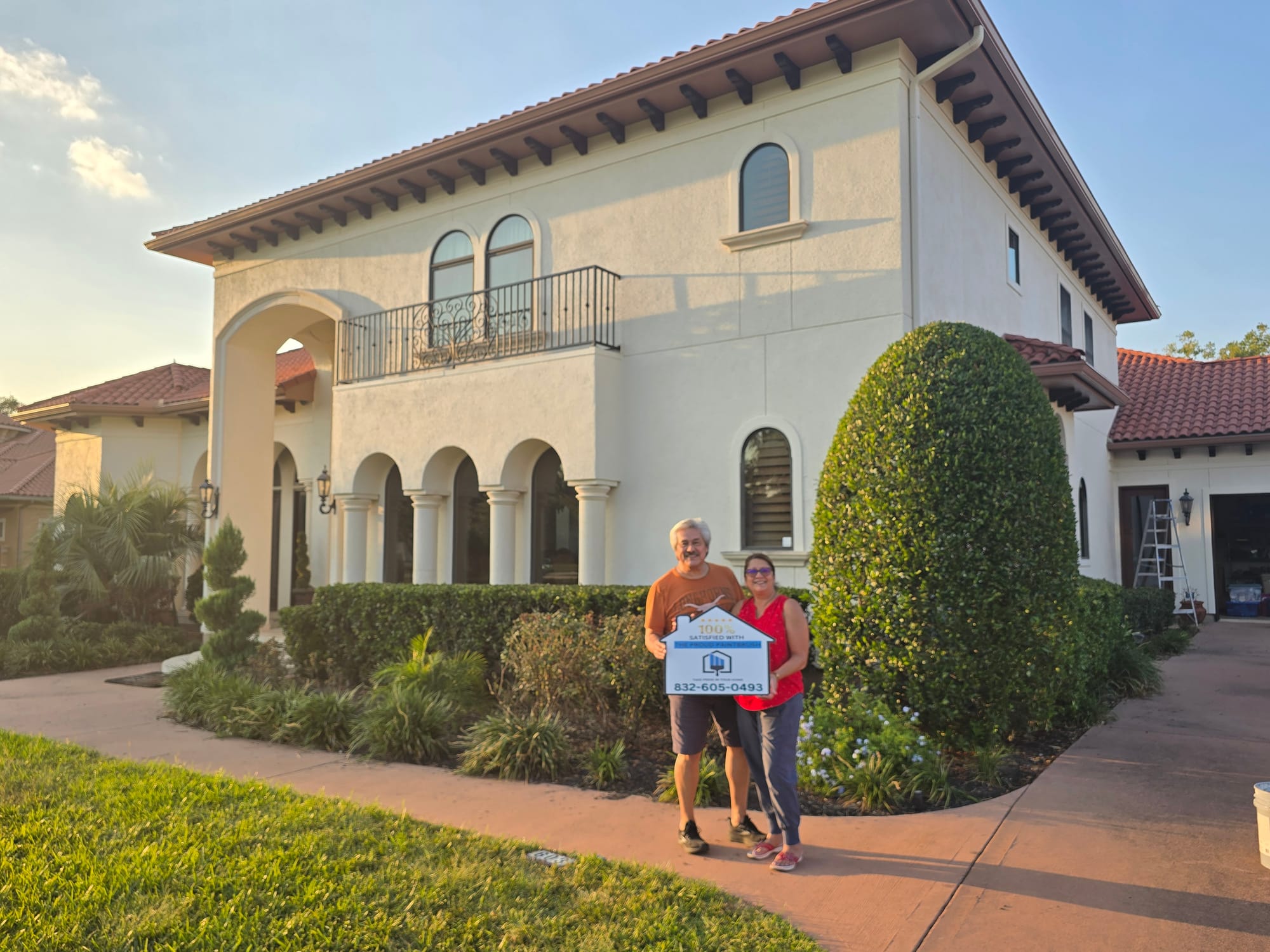 Happy customer after exterior house painting in Sugar Land, TX