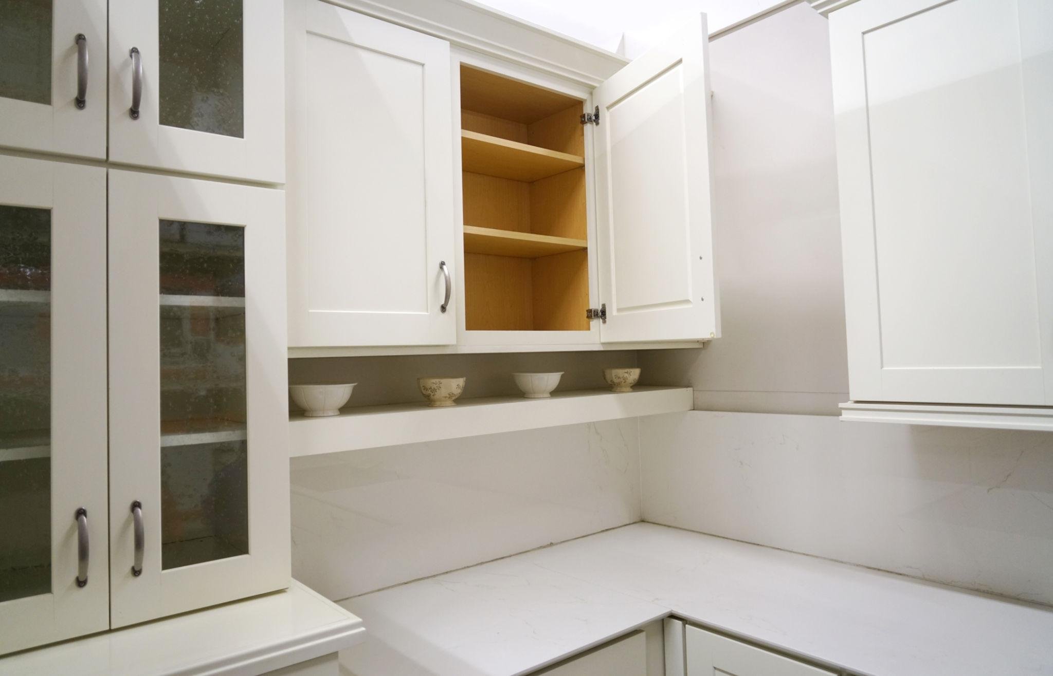 Interior kitchen cabinet painting in a Richmond TX home with freshly painted cabinets
