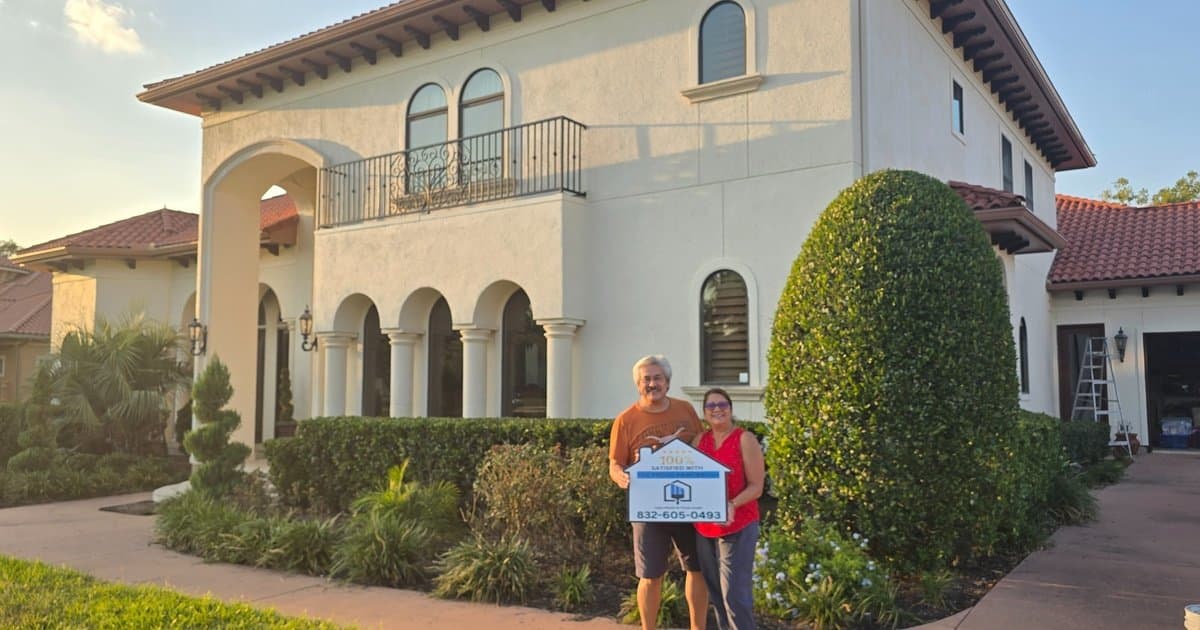Southwest Houston TX exterior painting customer holding 100% satisfied sign