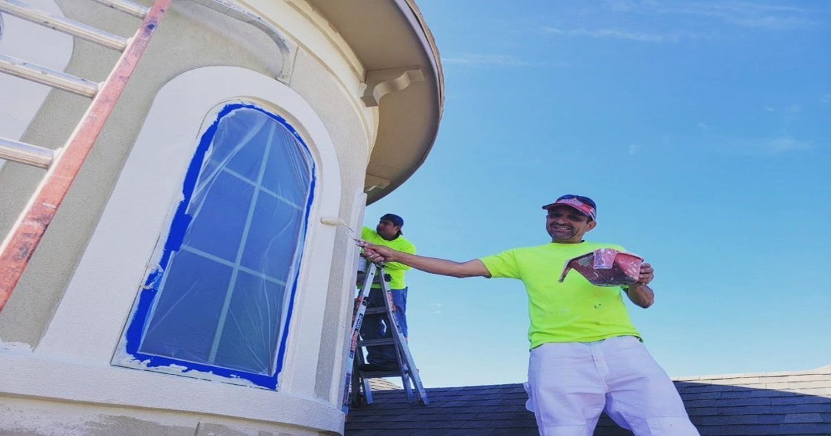 Exterior house painting in Sugar Land TX with two-story brick home and freshly painted trim