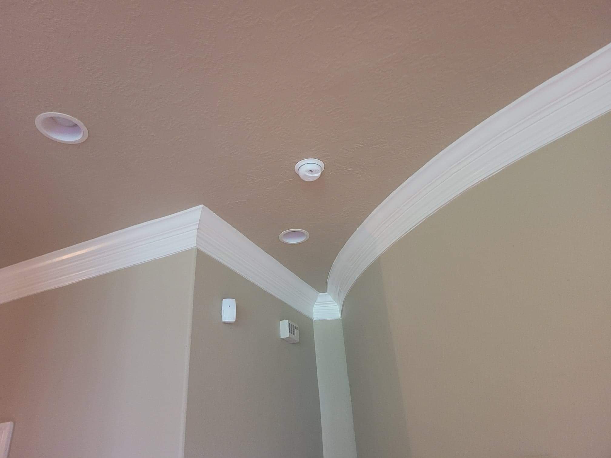 Interior painting of crown molding and woodwork in a Southwest Houston TX character home
