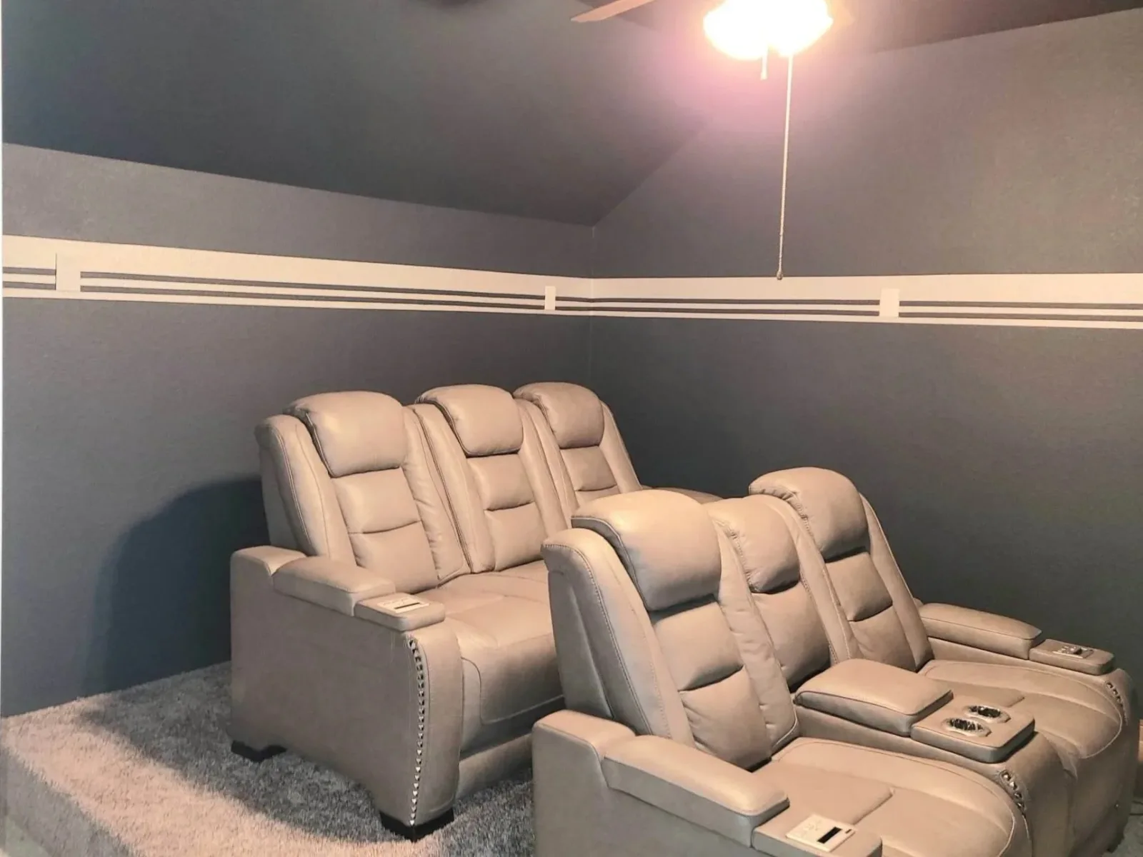 Media room with gray striped accent wall painted in Missouri City, TX by The Proud Paintbrush