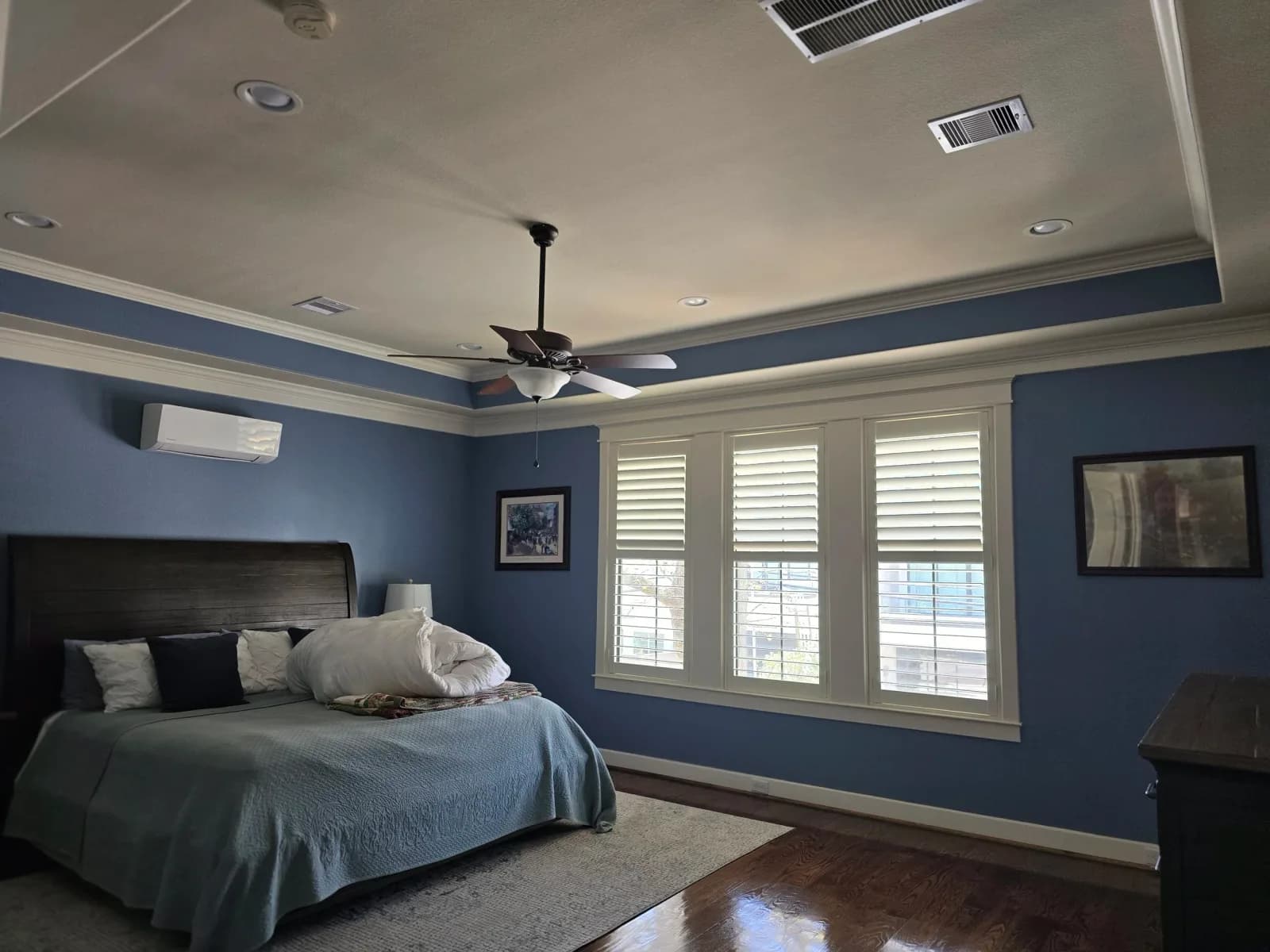 Master bedroom walls, ceiling, trim, and crown molding painted in Rosenberg, TX by The Proud Paintbrush