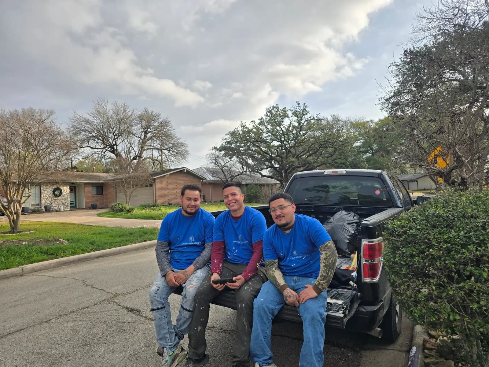 The Proud Paintbrush crew outside Gail's completed West Houston home