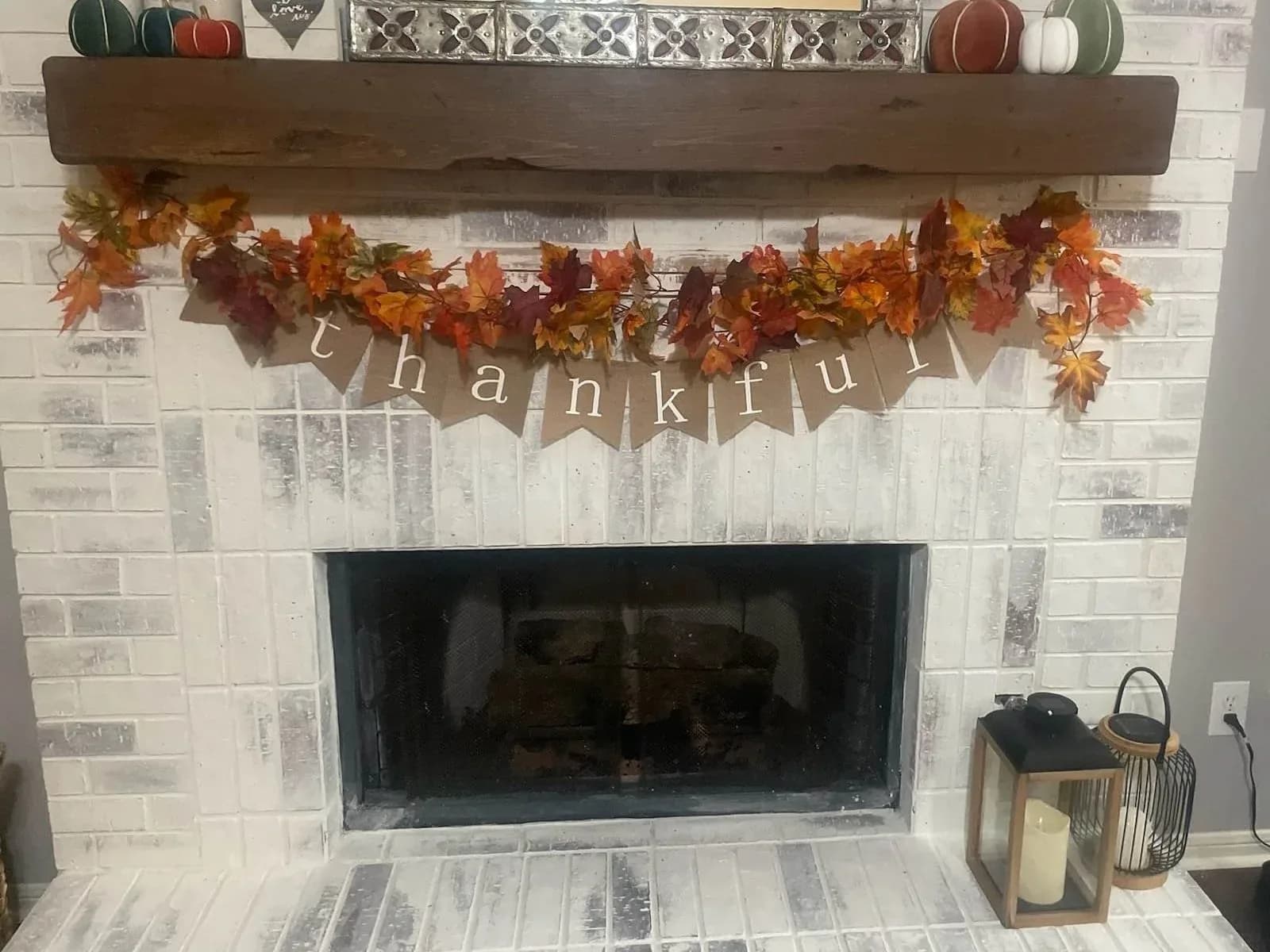 Whitewashed brick fireplace painted in a Sugar Land, TX home by The Proud Paintbrush