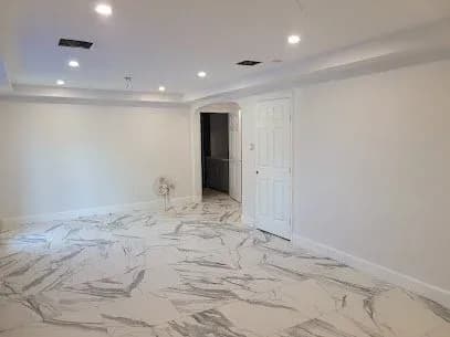 White living room with marble floors freshly painted in Missouri City, TX by The Proud Paintbrush