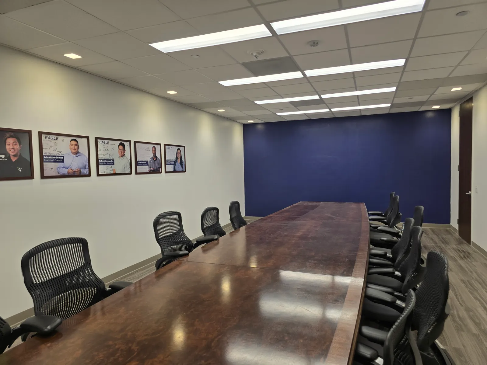 Office conference room with fresh accent wall painted by The Proud Paintbrush