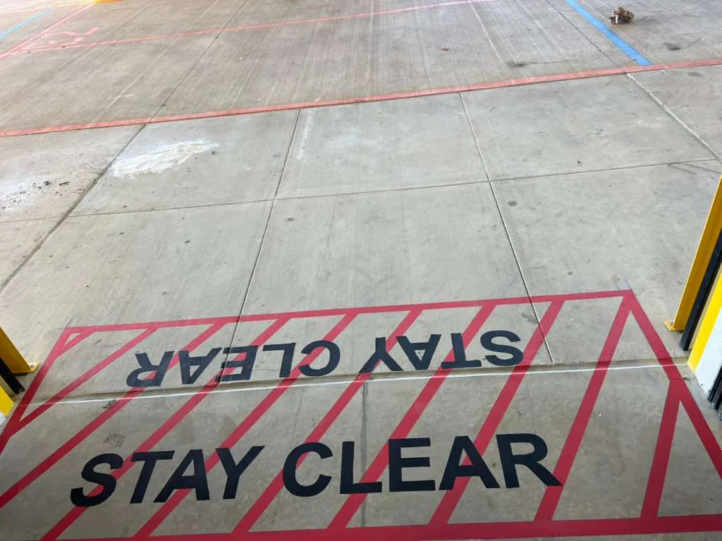 Warehouse interior with safety floor markings painted by The Proud Paintbrush