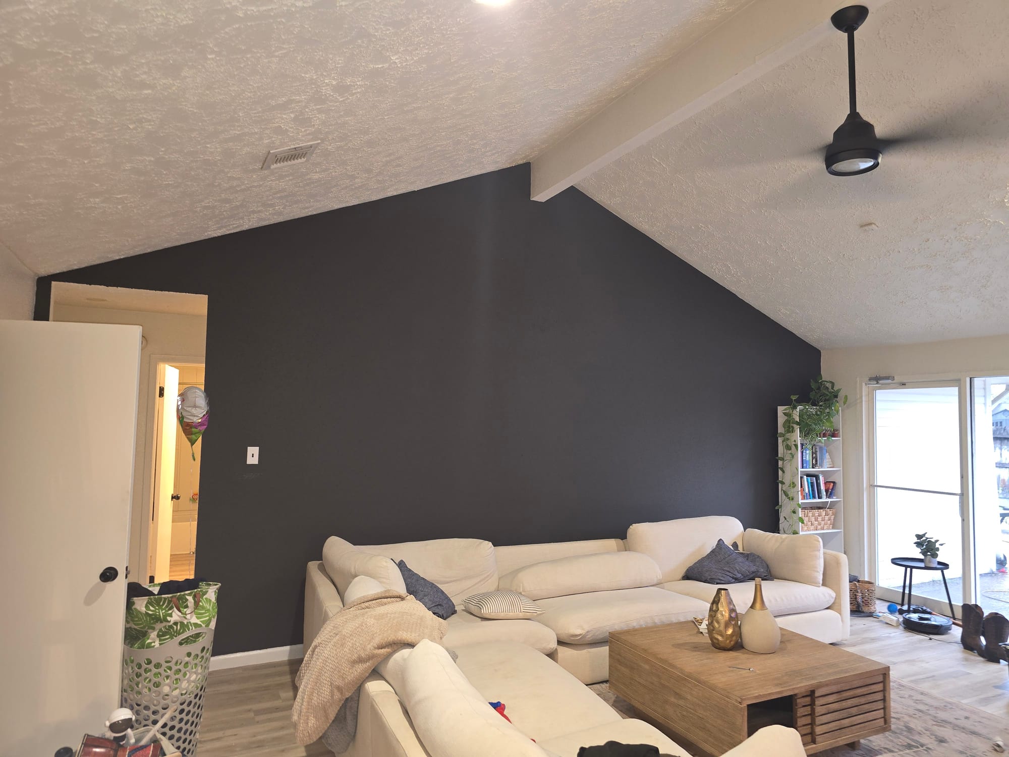 Dark Gray Accent Wall Living Room Repaint in West Houston, TX by The Proud Paintbrush