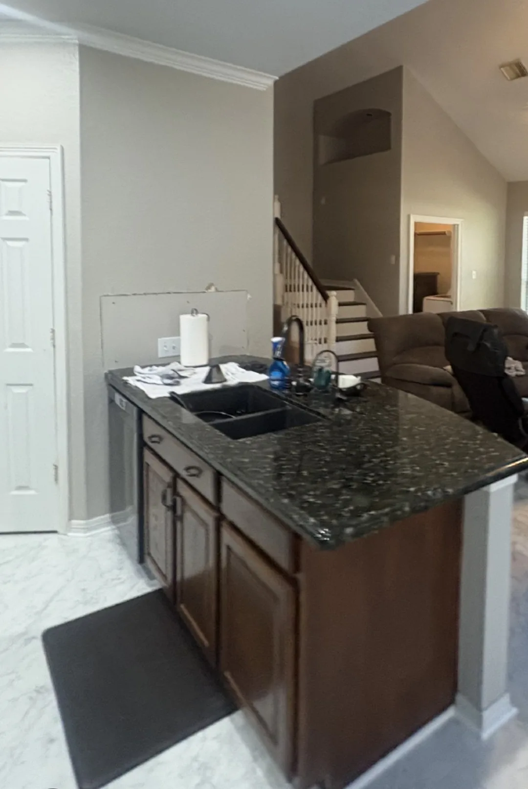 Dark wood kitchen island cabinets before cabinet refinishing in a Cinco Ranch home in Katy, TX