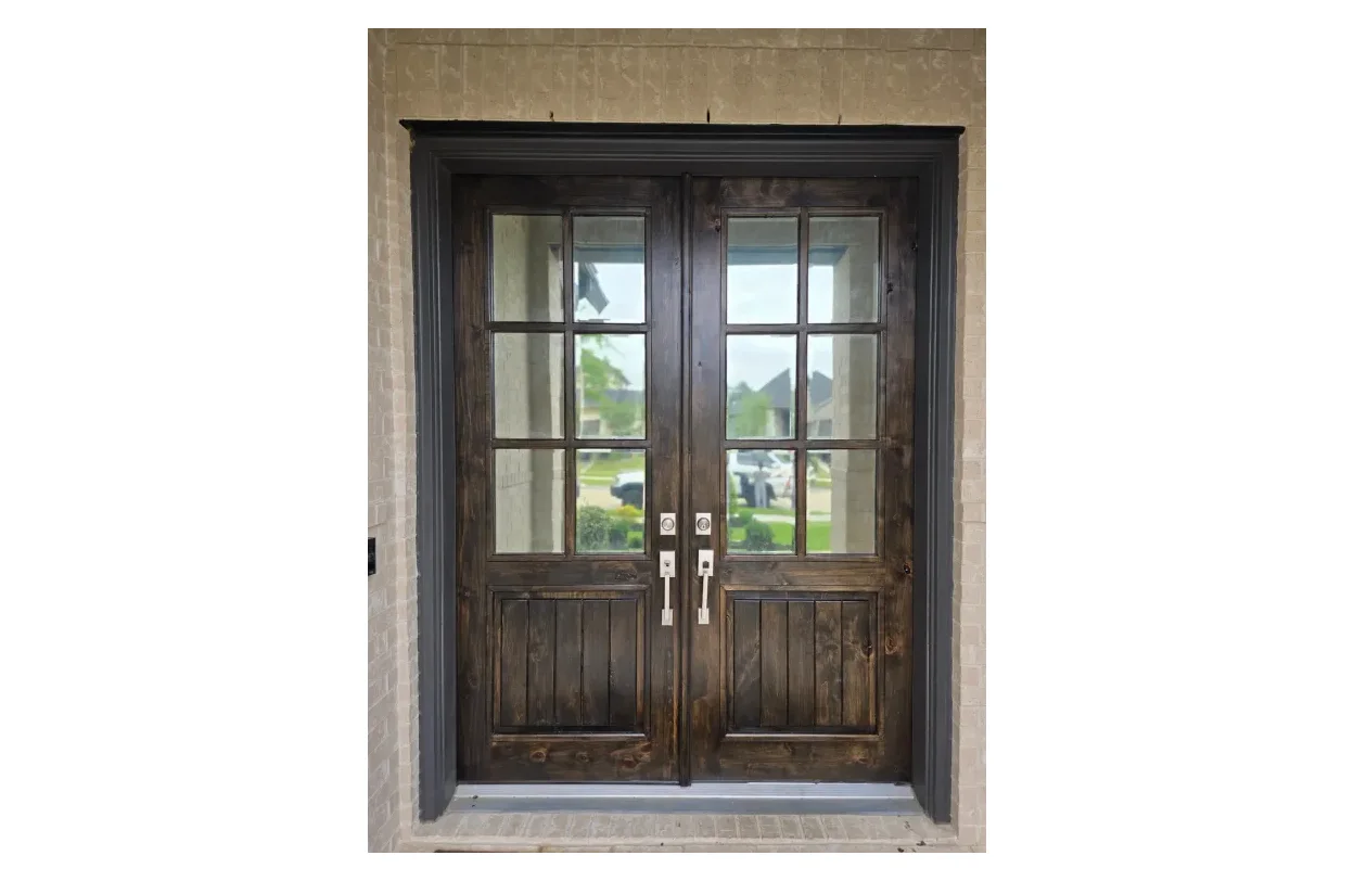 Refinished dark walnut double front doors in Katy, TX by The Proud Paintbrush