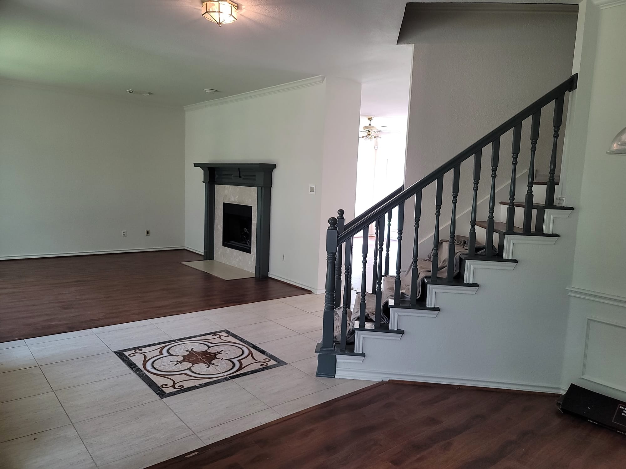 Living Room Stair Railing Repaint in Fulshear, TX by The Proud Paintbrush