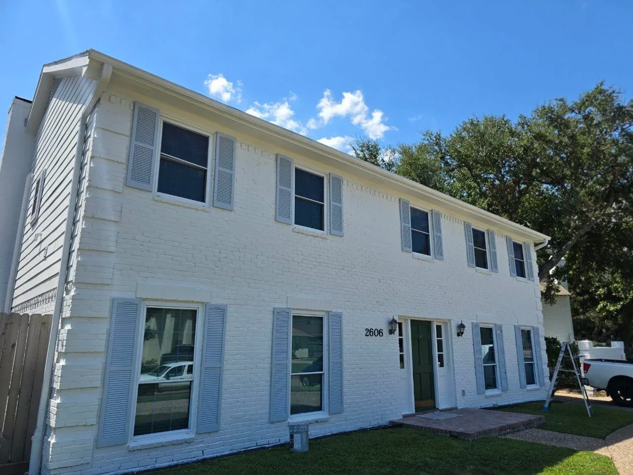 Large two-story home exterior painting project in Richmond, TX by The Proud Paintbrush.