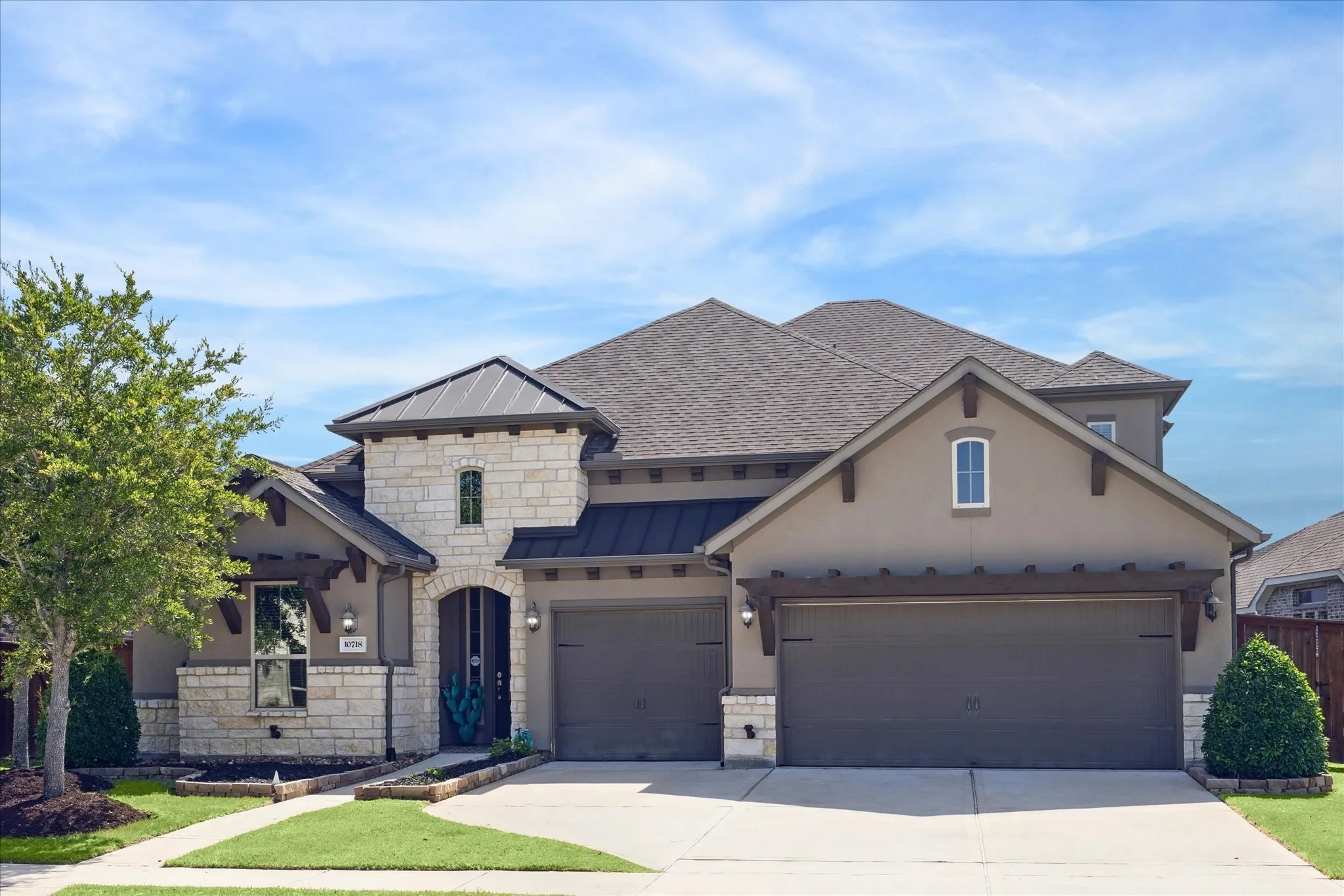 Stucco Stone Home Exterior in Missouri City, TX by The Proud Paintbrush