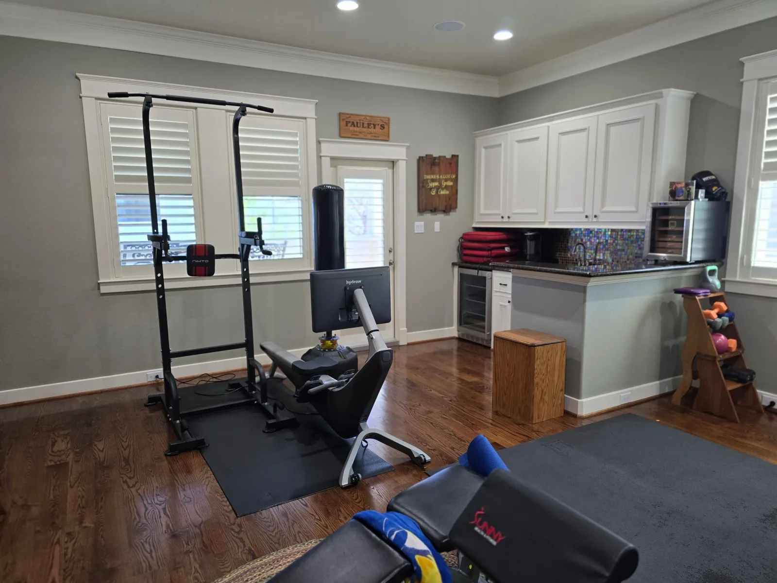 Freshly painted home gym and workout space in Sugar Land, TX interior painting project by The Proud Paintbrush.
