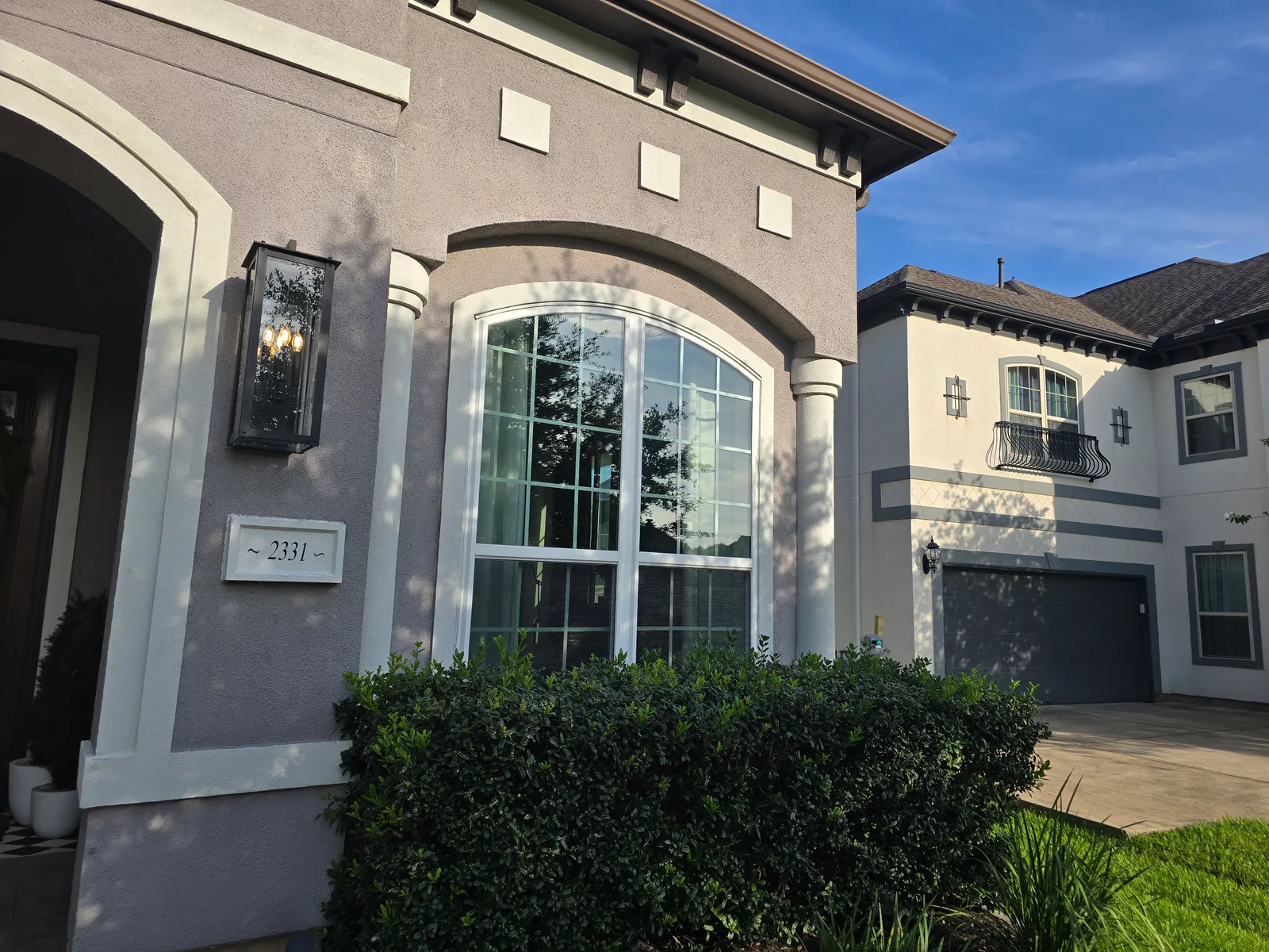 Faded tan stucco front entry exterior before repaint, Missouri City, TX