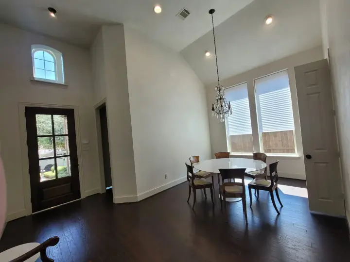 Open-concept living area with freshly painted walls and trim, delivering clean lines, even coverage, and a bright, cohesive interior finish.