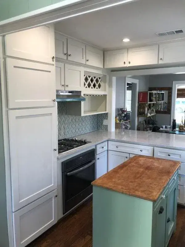 cabinet-painting-sugar-land-the-proud-paintbrush-two-tone-white-green-kitchen-cabinets.jpg
