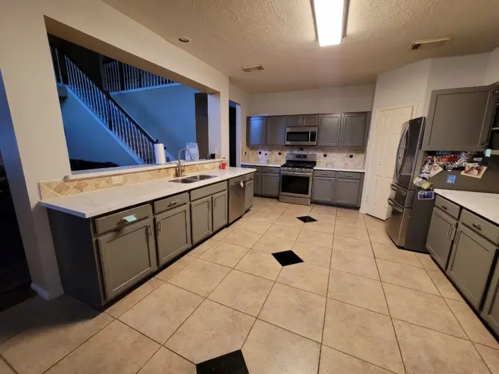 Freshly painted dark gray kitchen cabinets spray finish richmond TX