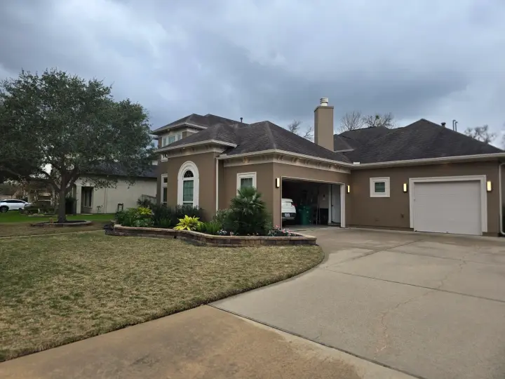 Single-story home exterior repaint with refreshed wall colors and trim, creating a clean, cohesive appearance and improved curb appeal.