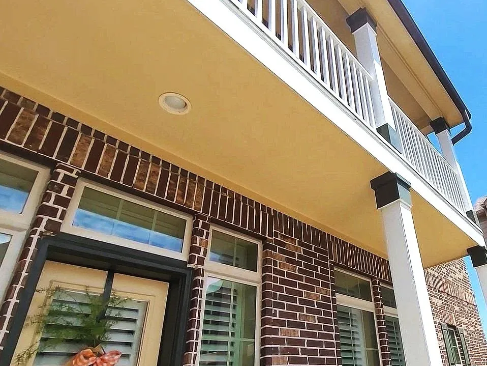 White Balcony Railing Gold Stucco Ceiling in Rosenberg, TX by The Proud Paintbrush