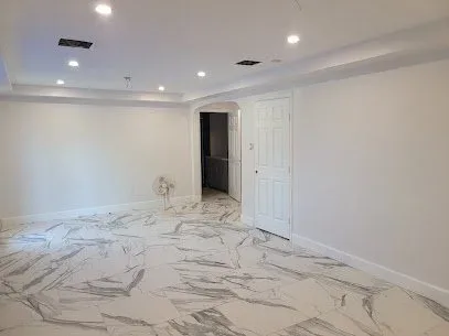 White Living Room Marble Floor Repaint in Missouri City, TX by The Proud Paintbrush