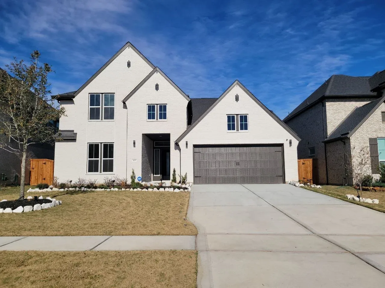 White Modern Farmhouse Exterior in Missouri City, TX by The Proud Paintbrush