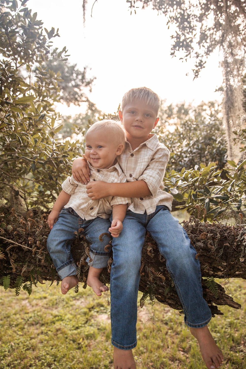 The Petkau brothers under an oak tree in Sugar Land, Texas — the family behind The Proud Paintbrush painting company