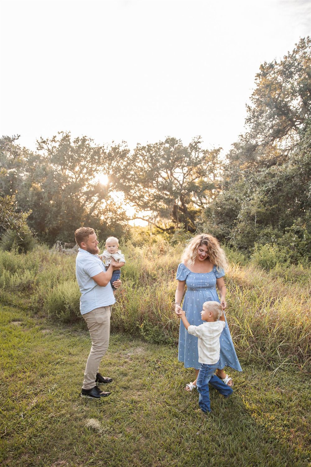 The Proud Paintbrush owner and family in a field in Sugar Land, TX — a locally owned painting company